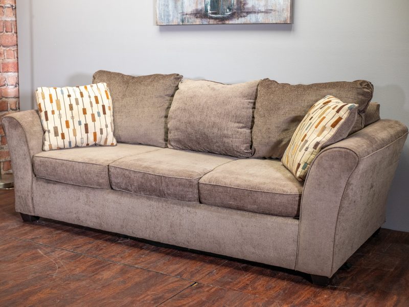 Brown couch with decorative pillows